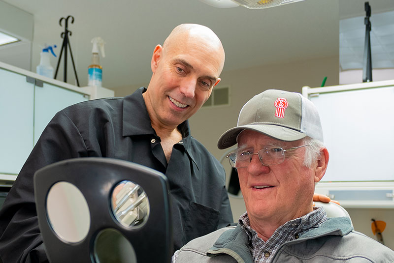 man with hat after full arch implants