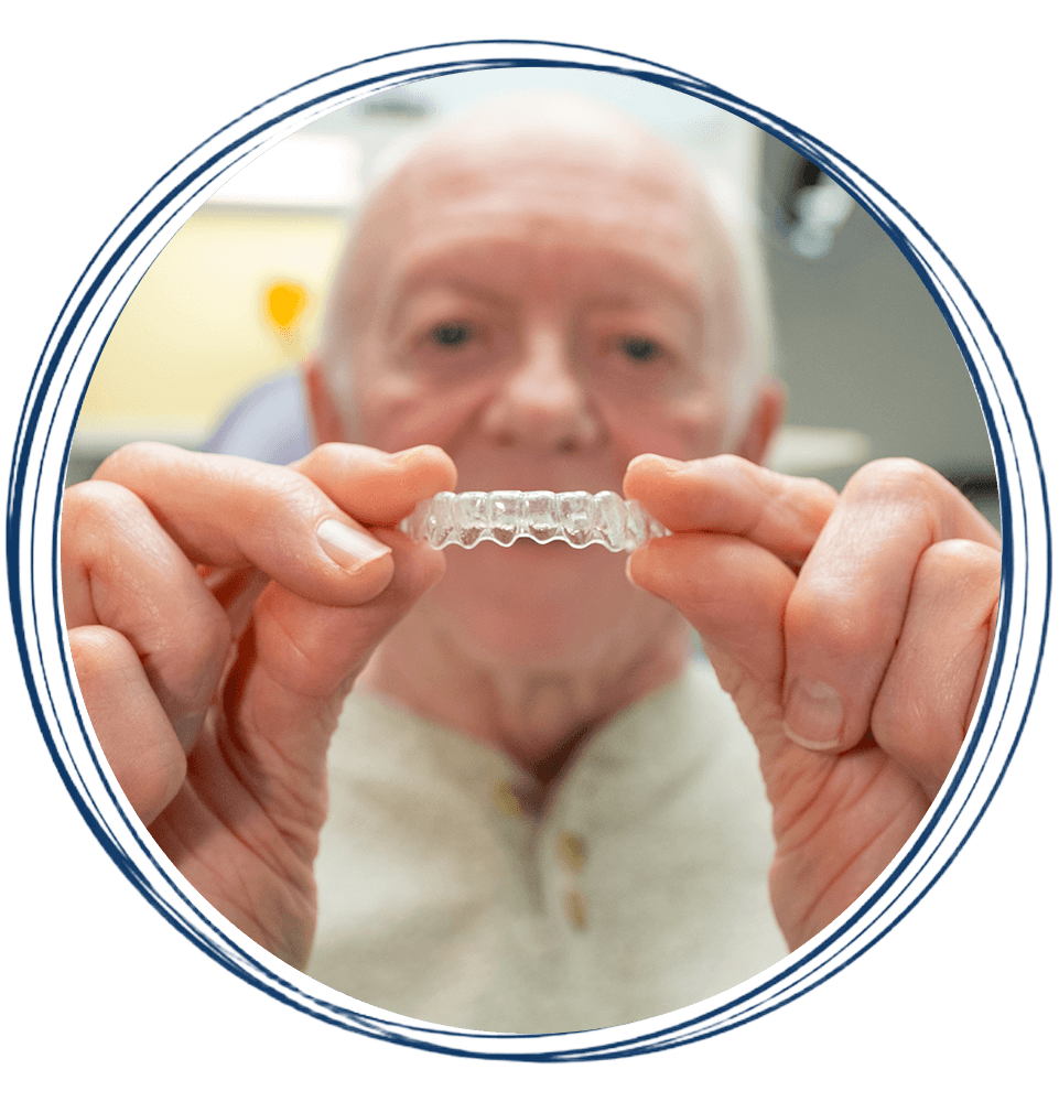 man with invisalign aligner