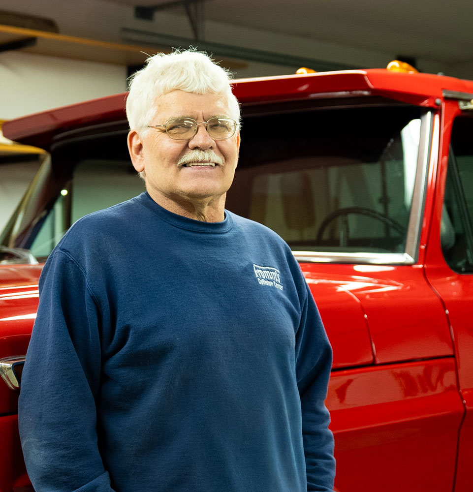 man after surgery in front of truck