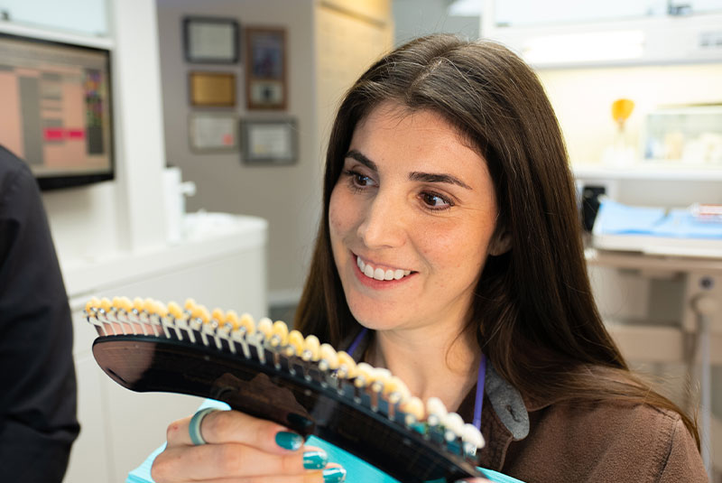patient looking over veneers